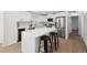 Stylish kitchen boasting a center island, stainless steel appliances, and modern white cabinets at 3247 S Newland St, Denver, CO 80227