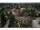 Aerial view of a charming home nestled among lush trees, showcasing its serene and private setting at 5290 Nassau E Cir, Cherry Hills Village, CO 80113