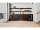 Custom-built bar area with open shelving, wine fridge, and ample counter space at 5290 Nassau E Cir, Cherry Hills Village, CO 80113