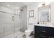 Contemporary bathroom with glass enclosed shower, modern vanity and unique light fixture at 5290 Nassau E Cir, Cherry Hills Village, CO 80113