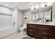 Elegant bathroom with double vanity, modern fixtures, and a tub/shower combo at 5290 Nassau E Cir, Cherry Hills Village, CO 80113