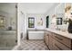 Bright bathroom featuring a modern tub, double windows, and stylish fixtures at 5290 Nassau E Cir, Cherry Hills Village, CO 80113