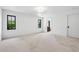 Bright bedroom with large windows and doorway to a connected ensuite bathroom at 5290 Nassau E Cir, Cherry Hills Village, CO 80113