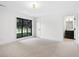 Bright bedroom featuring large window with views to backyard and ensuite bathroom at 5290 Nassau E Cir, Cherry Hills Village, CO 80113
