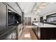 Spacious kitchen with stainless steel appliances, white cabinetry, and a large center island at 5290 Nassau E Cir, Cherry Hills Village, CO 80113