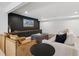 Cozy living room featuring a modern entertainment center and comfortable seating, perfect for relaxation at 5290 Nassau E Cir, Cherry Hills Village, CO 80113