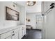 Stylish mudroom featuring custom cabinetry, a bench, and sleek tile flooring, blending functionality with modern design elements at 5290 Nassau E Cir, Cherry Hills Village, CO 80113