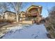 Back of house with a large deck, pergola and landscaping at 2031 Newton St, Denver, CO 80211