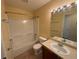 Cozy bathroom featuring single sink vanity and tiled shower tub at 11304 Niagara St, Thornton, CO 80233