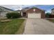Charming brick home with a well-manicured front yard and a two-car garage at 11304 Niagara St, Thornton, CO 80233