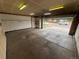 An empty two car garage with built in storage and an automatic door at 11304 Niagara St, Thornton, CO 80233