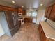 Functional kitchen featuring wood cabinets, tile floors, and stainless steel appliances at 11304 Niagara St, Thornton, CO 80233