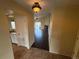 Inviting entryway with tile floors that flows into a spacious living area with vaulted ceilings and fireplace at 11304 Niagara St, Thornton, CO 80233