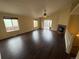 Bright and airy living room with hardwood floors, large windows, vaulted ceilings, and a fireplace at 11304 Niagara St, Thornton, CO 80233