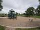 Community playground featuring a swing set and jungle gym under a cloudy sky at 11304 Niagara St, Thornton, CO 80233