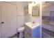 Bathroom features updated vanity and wood-look tile at 1620 Colorado Blvd # 6, Denver, CO 80220