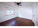 Bright bedroom with hardwood floors and ceiling fan at 1620 Colorado Blvd # 6, Denver, CO 80220