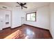 Bedroom with hardwood floors and large window at 1620 Colorado Blvd # 6, Denver, CO 80220