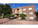 Brick building exterior with landscaping and walkway at 1620 Colorado Blvd # 6, Denver, CO 80220