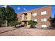 Brick building exterior with landscaping and walkway at 1620 Colorado Blvd # 6, Denver, CO 80220