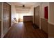 Building hallway with wooden floors and access to stairs at 1620 Colorado Blvd # 6, Denver, CO 80220