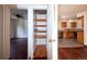 Kitchen with ample storage and view into adjacent room at 1620 Colorado Blvd # 6, Denver, CO 80220