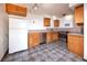 Kitchen with wood cabinets and tile flooring at 1620 Colorado Blvd # 6, Denver, CO 80220