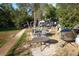 Outdoor patio area with table and chairs, fire pit, and grill at 1620 Colorado Blvd # 6, Denver, CO 80220