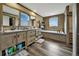 Spacious bathroom boasts double vanity, storage, bathtub, and scenic window views at 4255 S County Road 185, Byers, CO 80103