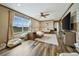Bright living room with large window, plush seating, and modern decor, perfect for relaxation and comfort at 4255 S County Road 185, Byers, CO 80103
