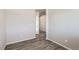 A simple bedroom featuring hard wood floors, base trim and neutral paint throughout at 296 N Newcastle Way, Aurora, CO 80018