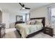 A main bedroom features a ceiling fan, carpet floors, and bedside tables at 296 N Newcastle Way, Aurora, CO 80018