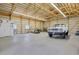 Spacious barn with high ceilings, exposed wood beams, and plenty of room for equipment and vehicles at 3596 Longs Peak Cir, Parker, CO 80138