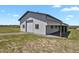 Large barn featuring a rolling door and covered area perfect for storage and outdoor activities at 3596 Longs Peak Cir, Parker, CO 80138
