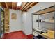 Unfinished basement utility room with shelving and storage at 3596 Longs Peak Cir, Parker, CO 80138