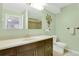 Bright bathroom with a large mirror, vanity, and toilet at 3596 Longs Peak Cir, Parker, CO 80138