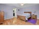 Relaxing bedroom with a bed, dresser, and a door to a bathroom at 3596 Longs Peak Cir, Parker, CO 80138