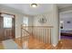 Inviting entryway with hardwood floors, staircase, and decorative wall art at 3596 Longs Peak Cir, Parker, CO 80138