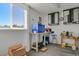 Garage interior showcasing storage cabinets, workbench area, and a well-lit workspace at 3596 Longs Peak Cir, Parker, CO 80138
