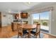 Eat-in kitchen features wood cabinets, granite counters, with walk-out to deck at 3596 Longs Peak Cir, Parker, CO 80138