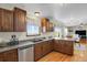 Charming kitchen features granite countertops, stainless steel appliances and rich wood cabinetry at 3596 Longs Peak Cir, Parker, CO 80138