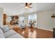 Bright and airy living room with hardwood floors, large windows and open floor plan at 3596 Longs Peak Cir, Parker, CO 80138