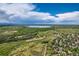 Aerial view showcasing the neighborhood's location near a lake with scenic views and recreational opportunities at 14030 E Progress Way, Aurora, CO 80015