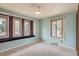 Bedroom showcases three windows, providing ample natural light, carpeted flooring, and painted accent wall at 14030 E Progress Way, Aurora, CO 80015