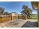 Wooden deck with a railing, outdoor seating, and scenic views of the backyard and countryside at 14030 E Progress Way, Aurora, CO 80015