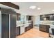 Bright kitchen with a farmhouse sink, updated appliances, and custom cabinetry, blending style and function at 14030 E Progress Way, Aurora, CO 80015