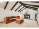 Comfortable living room with a plush sofa, a fireplace, and vaulted ceilings, offering a relaxing space at 14030 E Progress Way, Aurora, CO 80015
