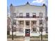 Stately white building facade with symmetrical windows, brick accents, and a central entrance at 1629 N Clarkson St # 23, Denver, CO 80218