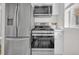 Well-equipped kitchen featuring stainless steel appliances, modern cabinetry, and a functional layout at 1629 N Clarkson St # 23, Denver, CO 80218
