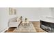 Open-concept living area with stylish decor, hardwood flooring, and comfortable seating at 1629 N Clarkson St # 23, Denver, CO 80218